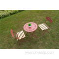 Table and Wood Slat Chairs with Leaf Pattern